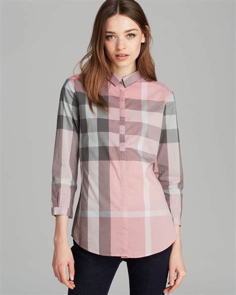 pink burberry button up shirt.